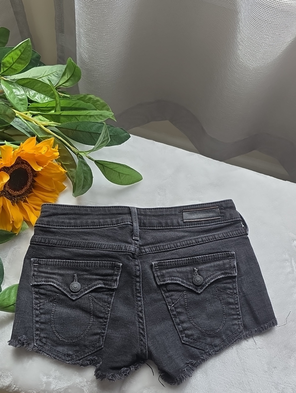 True Religion Black Denim Cutoff Shorts with Signature Pocket Stitching
